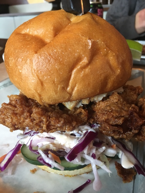 Fried Chicken Sandwich - fried chicken thigh, house pickled cucumbers, cabbage slaw. $9